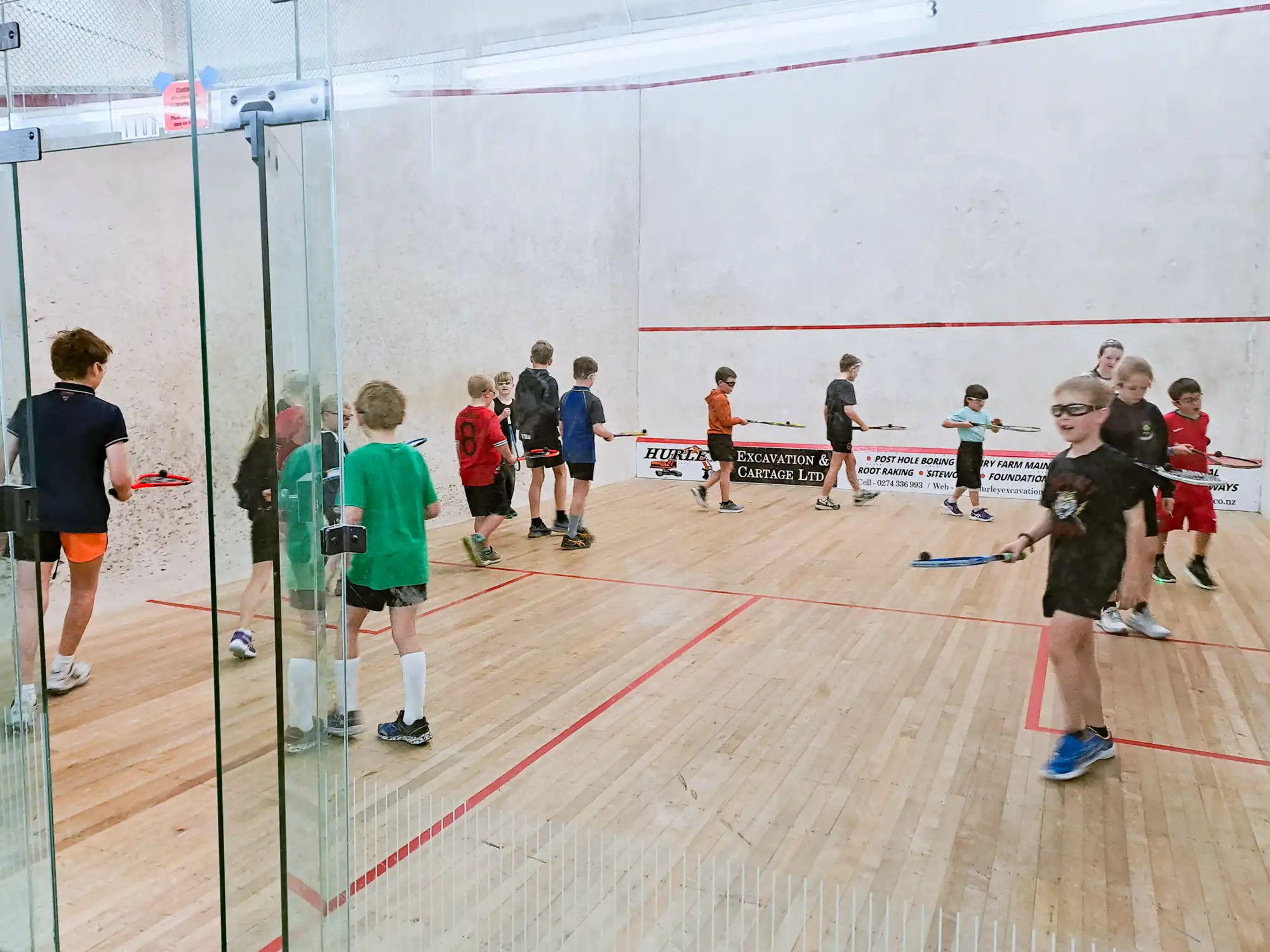 Young squash players at coaching session.