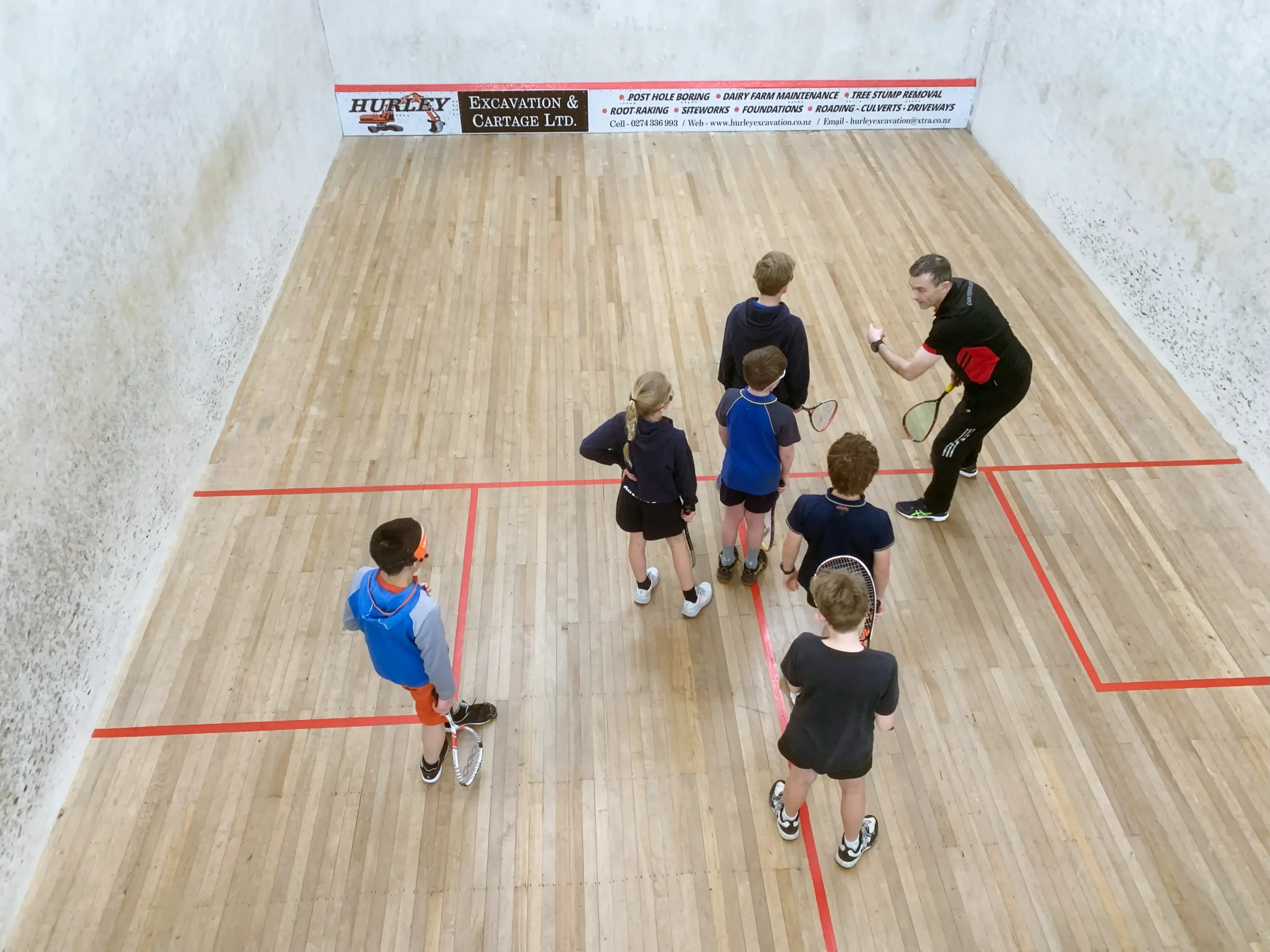 Junior squash coaching.
